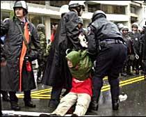 protester dragged by police